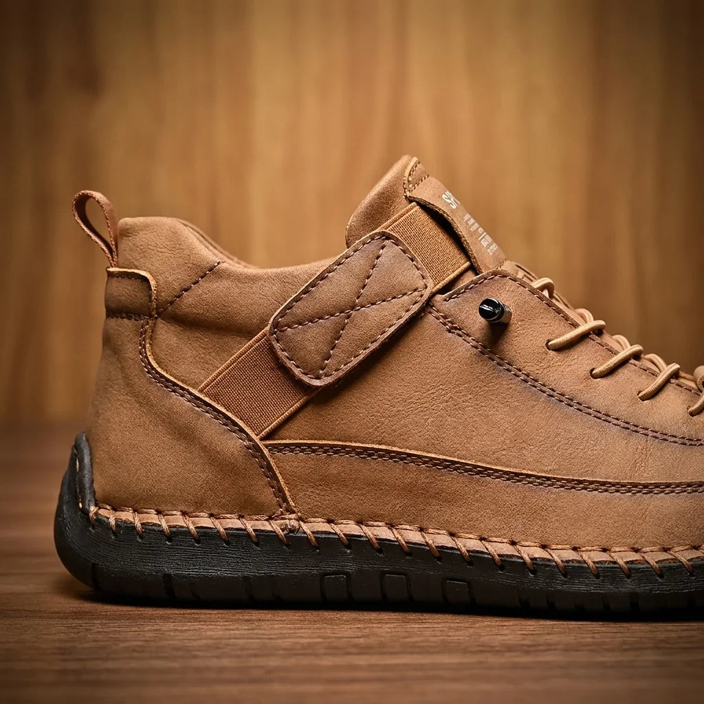Close-up of hand-stitched brown slip-on shoe with elastic strap