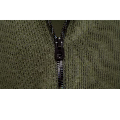 Close-up of the quarter zip on the green Alcott sweater