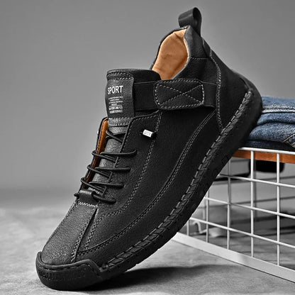 Black slip-on casual shoe with hand-stitched sides and elastic laces