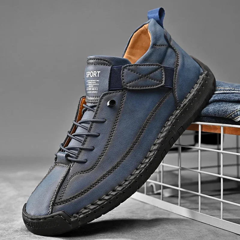 Blue slip-on casual shoe with hand-stitched sides and elastic laces