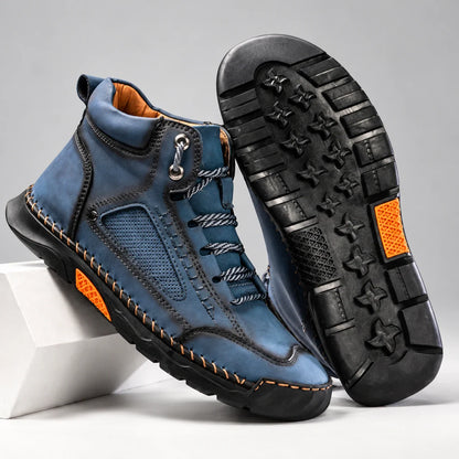 Bradshaw men's hiking boots in blue, pair with outsole detail on a light studio background