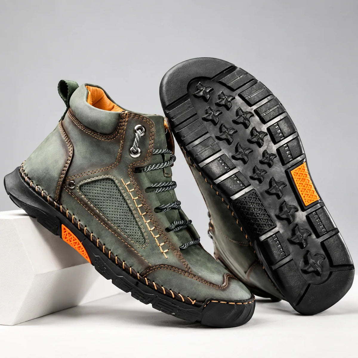 Bradshaw men's hiking boots in green, pair with outsole detail on a light studio background