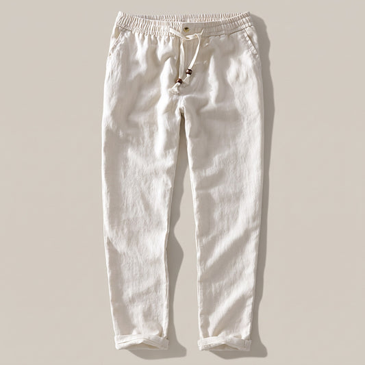 Men's cream drawstring pants with an elastic waist and rolled hem, front view