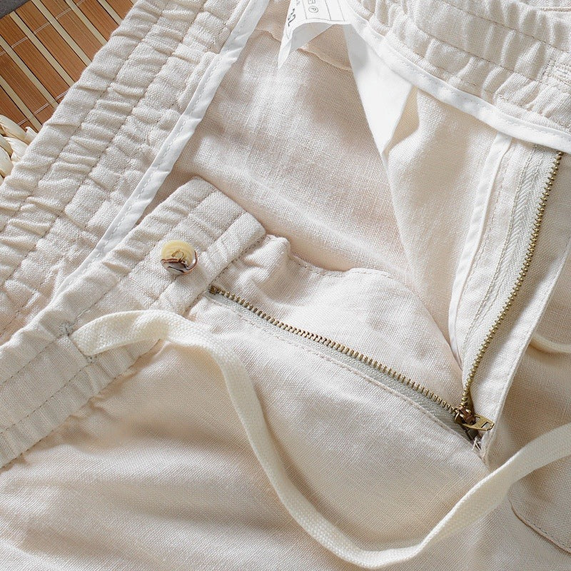 Close view of the fly, button and drawstring waistband