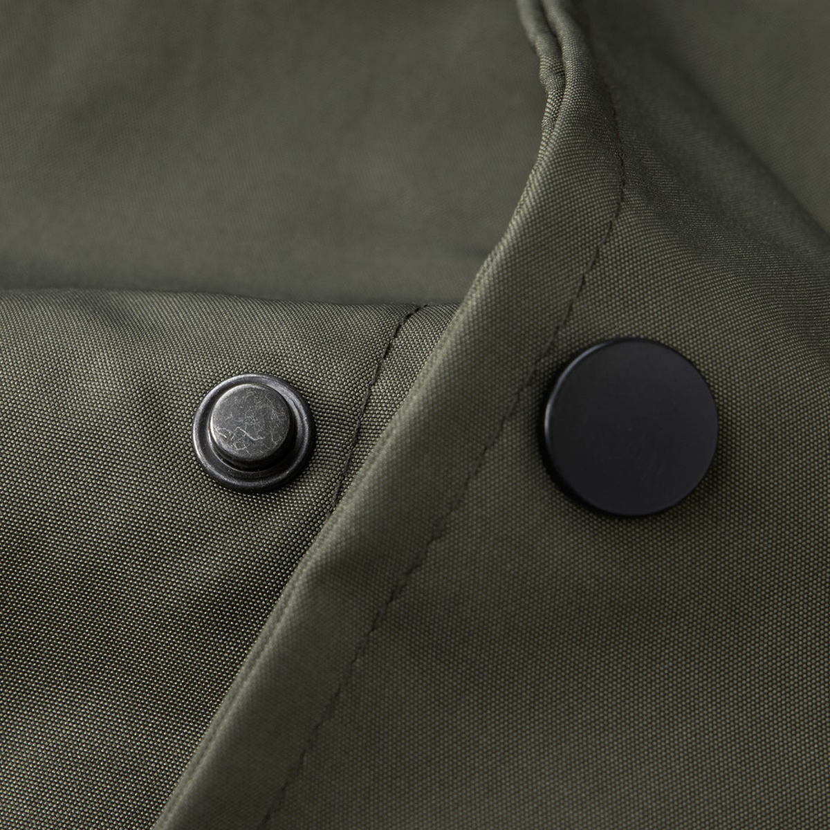 Garrison varsity jacket snap closure close-up
