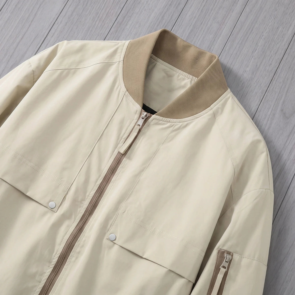 Men's bomber jacket with snap pockets ribbed collar, zip and snap chest pocket close-up