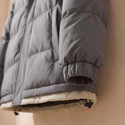 Men's hooded puffer jacket elastic cuff and hem toggle close-up