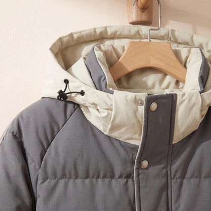Men's hooded puffer jacket drawcord hood and snap front close-up
