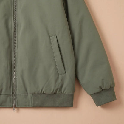 Men's padded bomber jacket pocket and ribbed cuff close-up