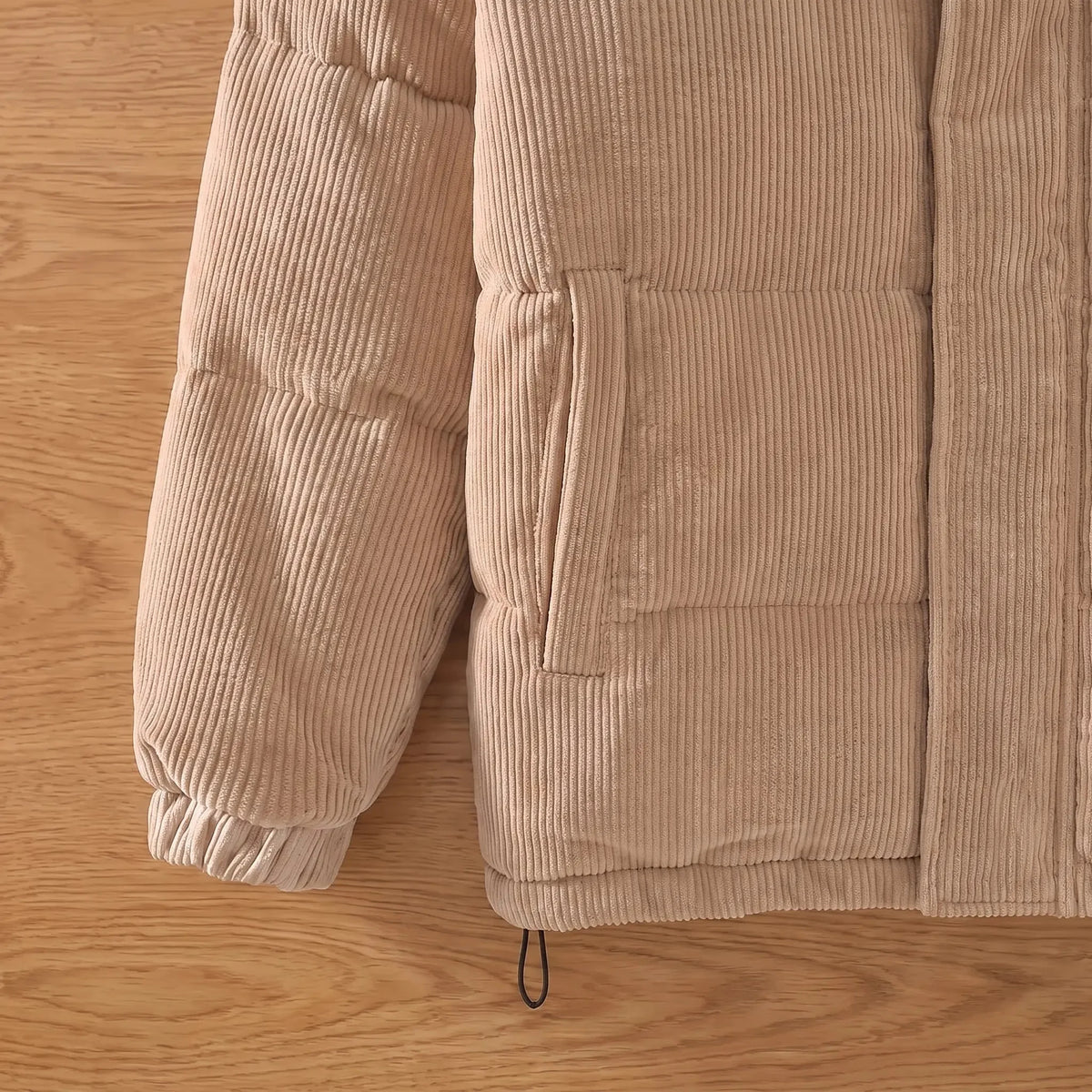 Men's padded corduroy puffer jacket welt pocket, quilted channels and hem close-up