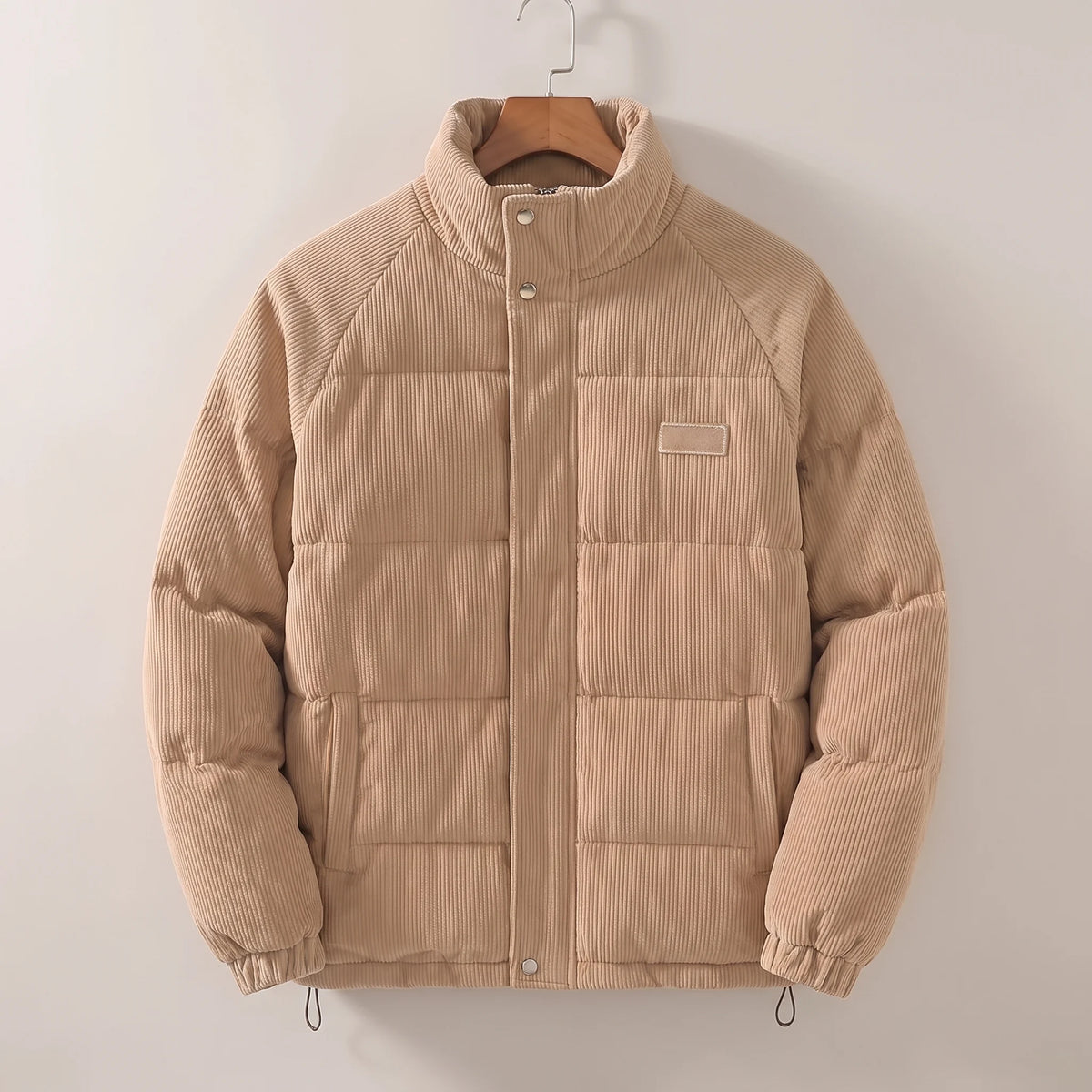 Men's padded corduroy puffer jacket, studio view
