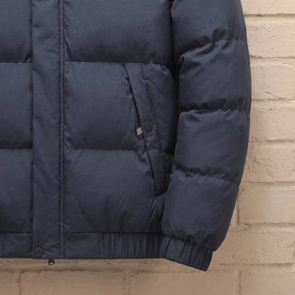Men's stand-collar puffer jacket zip pocket and rib cuff close-up