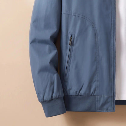 Men's zip bomber jacket zip pocket and rib cuff close-up