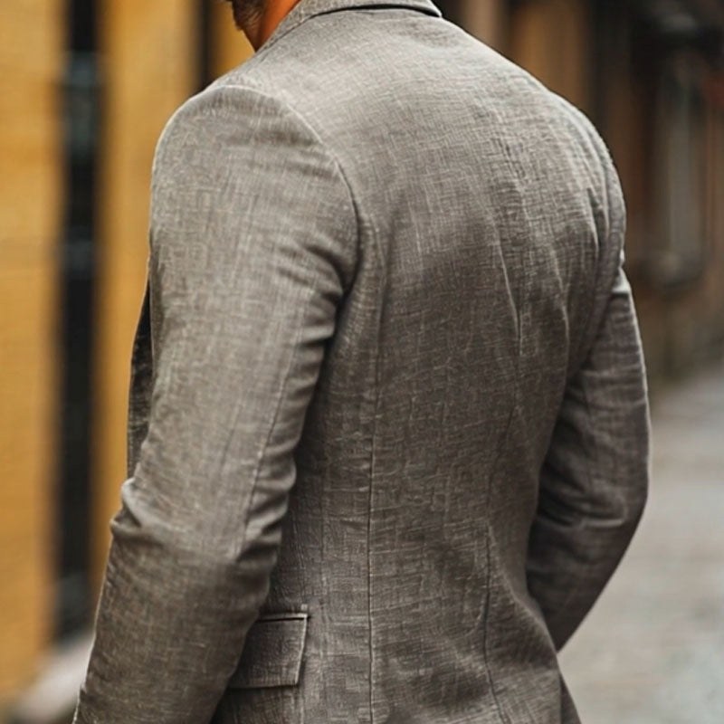 Back of the textured sport coat on a model, seen from behind