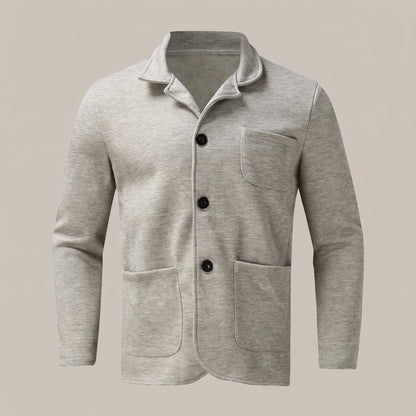 Light gray unstructured blazer with three buttons and patch pockets, front view