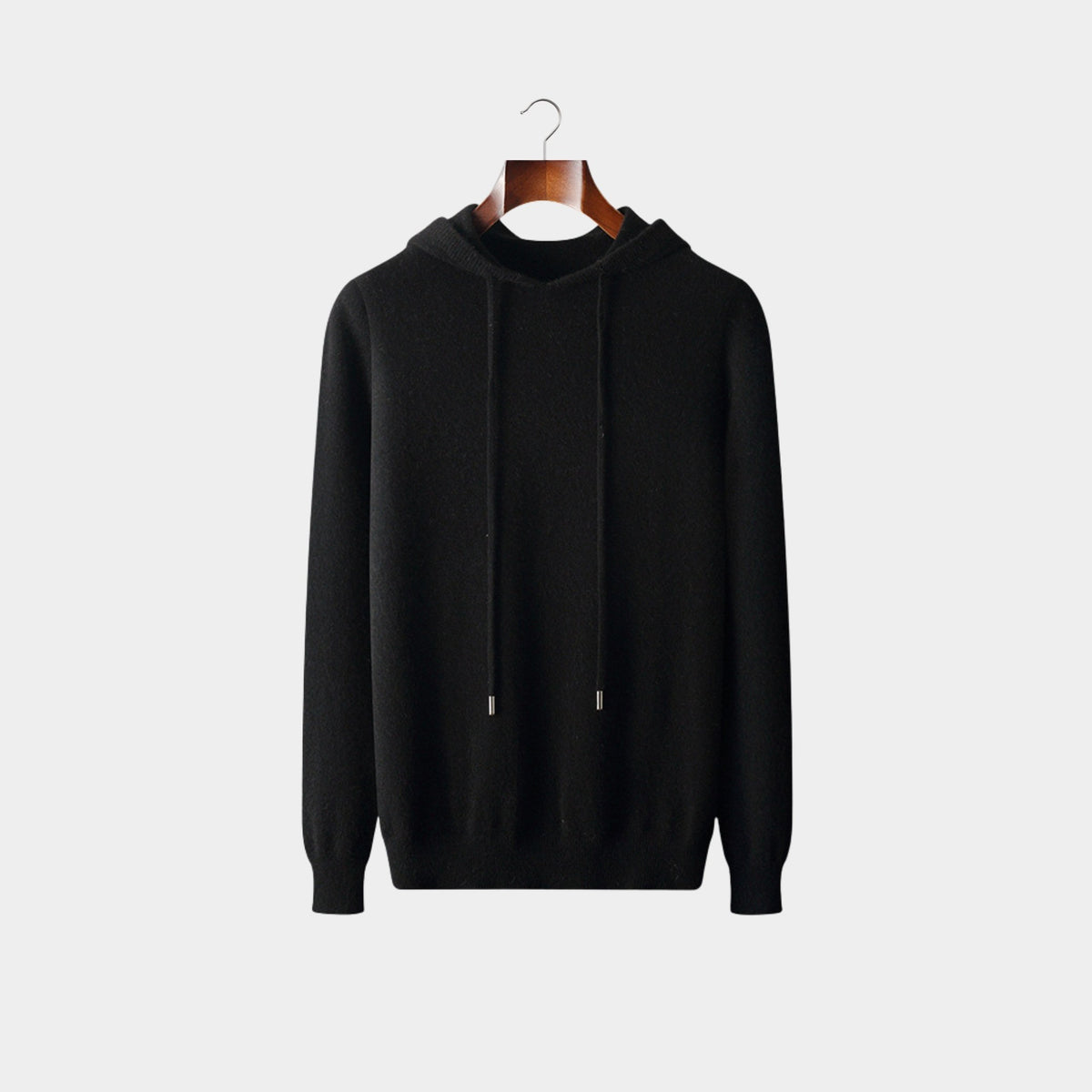 Black knit hooded sweater with drawcord and ribbed cuffs, front view