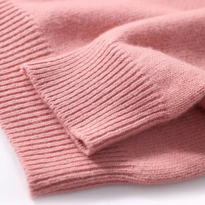 Close view of the ribbed cuff on the knit sweater