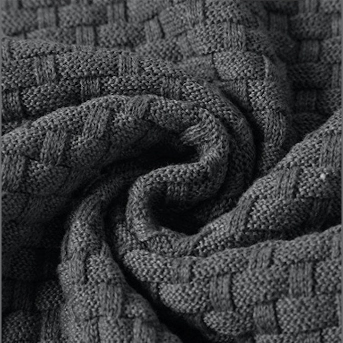 Close view of the basket-weave knit texture on the hooded pullover