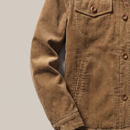 Close view of the chest flap pocket and buttons on the trucker jacket