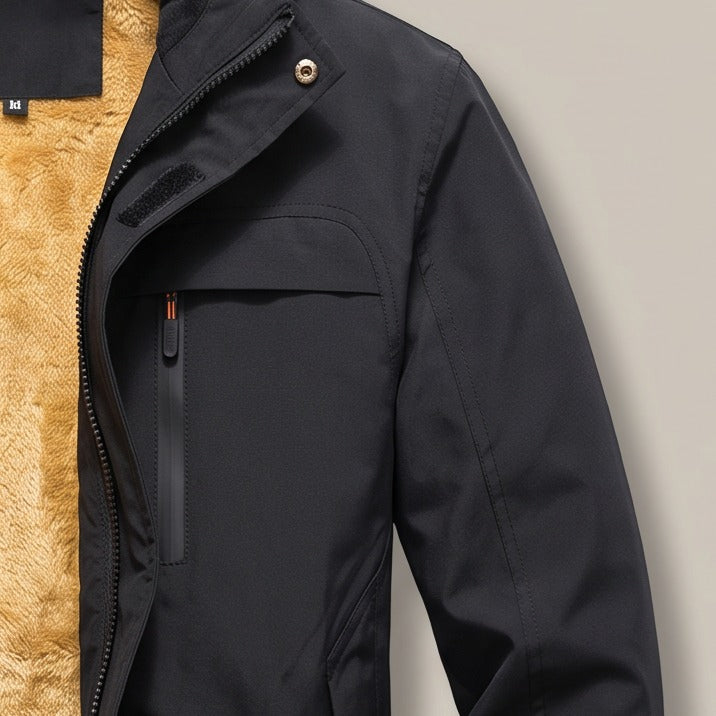 Close view of the zip chest pocket on the hooded zip jacket