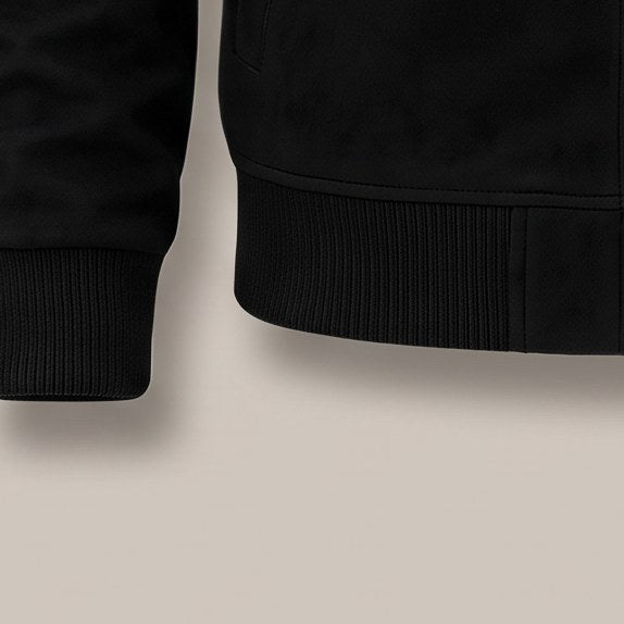 Close view of the ribbed hem on the zip bomber jacket