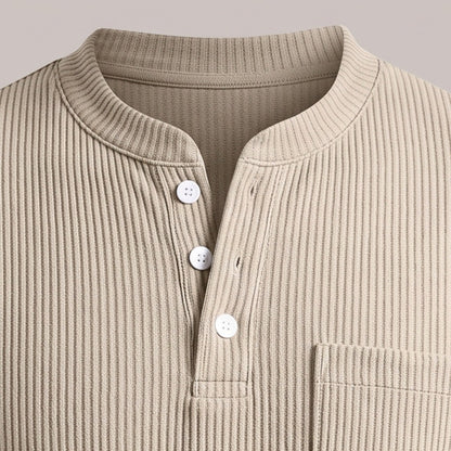 Close view of the round band neckline and three-button placket on the henley