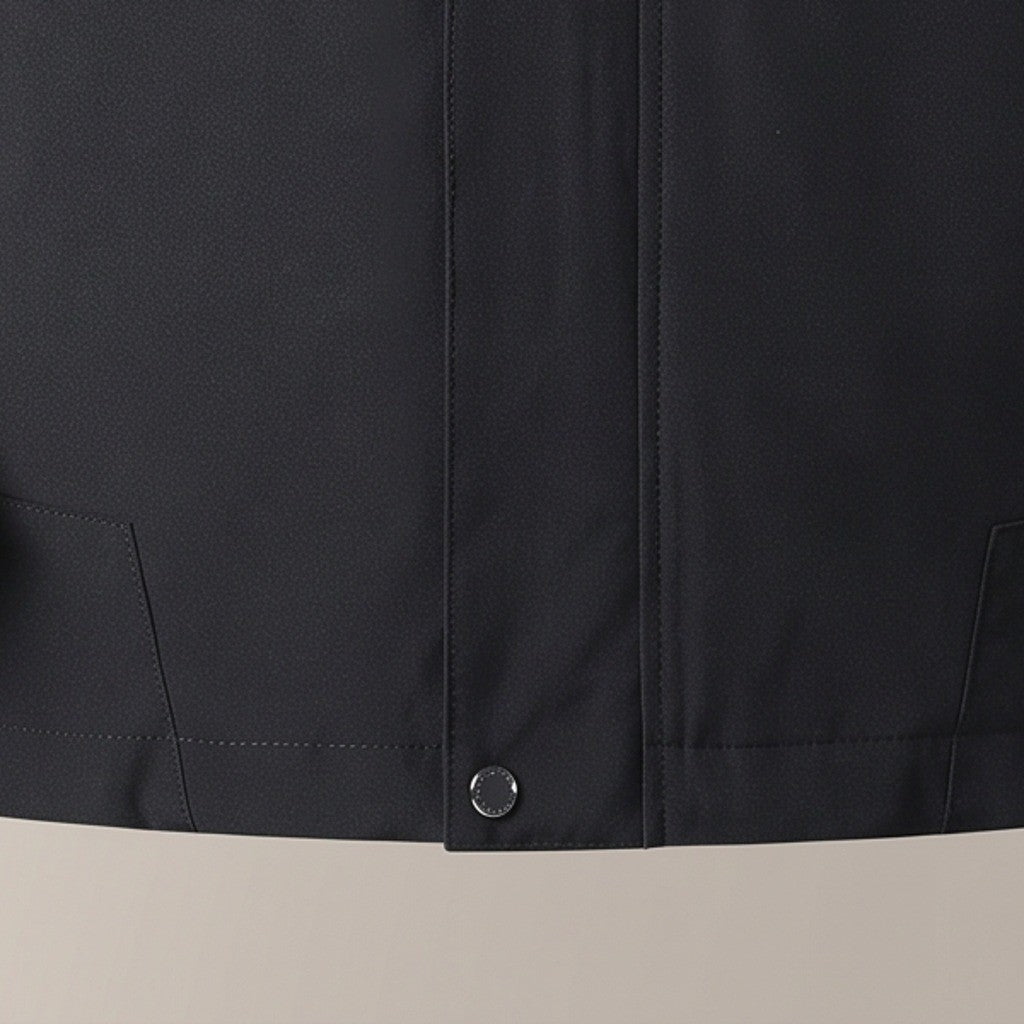 Close view of the front zip and snap hem on the outdoor jacket