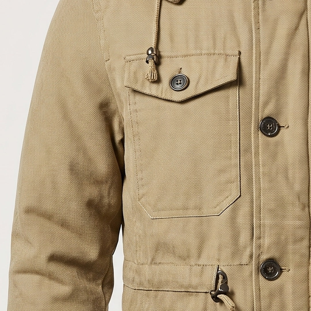 Chest flap and zip pockets on a men's hooded utility jacket