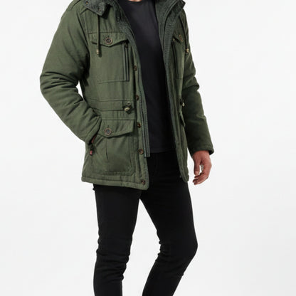 Green men's hooded utility jacket worn open over a black tee