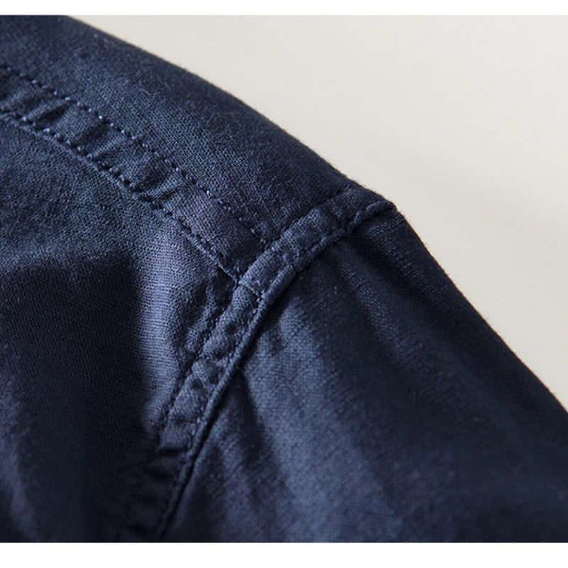 Close view of the shoulder seam and fabric on the navy shirt