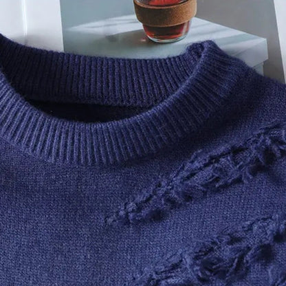Close view of the ribbed neckline and distressed knit on the blue knit