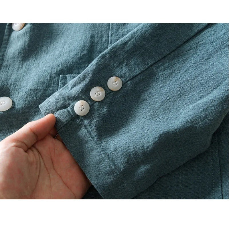 Close view of the buttons on the blue blazer sleeve