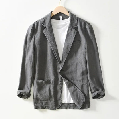 Gray single-button blazer with notch lapel and patch pockets, front view