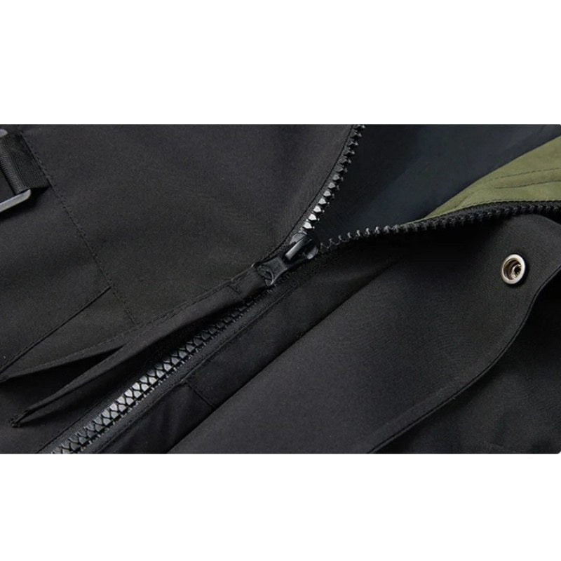 Close view of the zip and snap on the black jacket