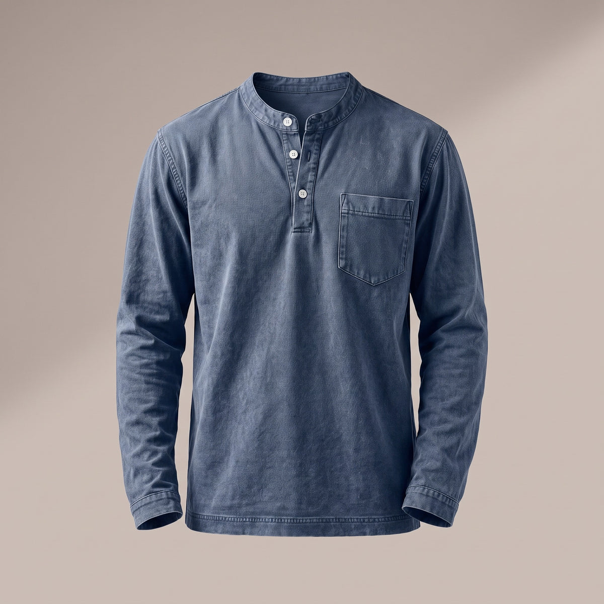 Washed blue long sleeve henley with a three-button placket and a chest pocket, front view