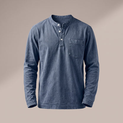 Washed blue long sleeve henley with a three-button placket and a chest pocket, front view