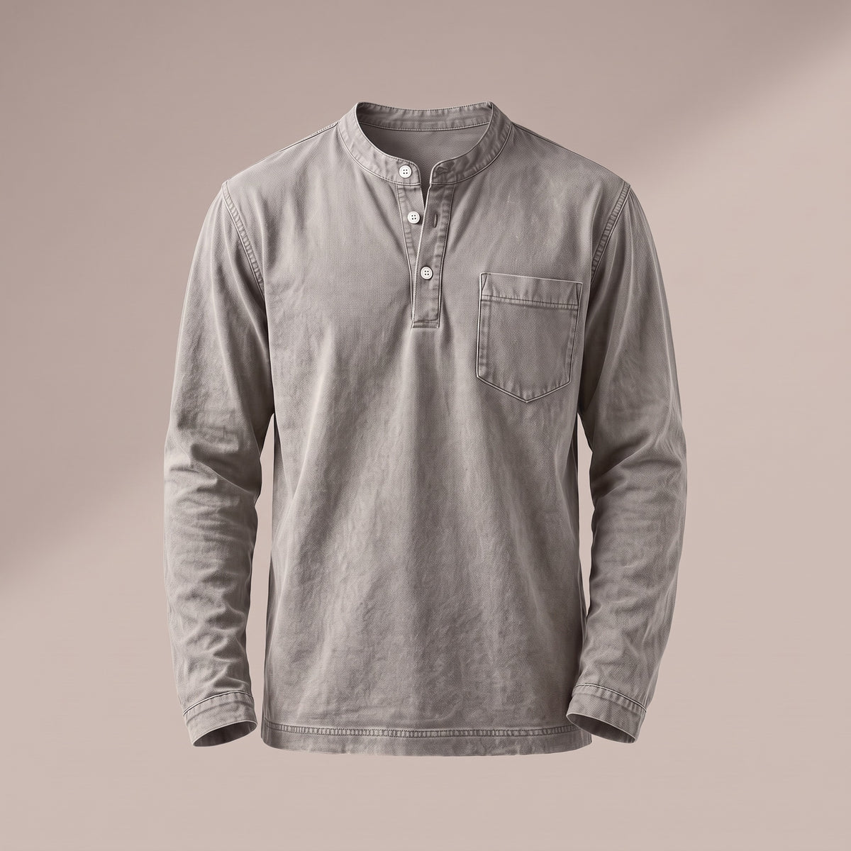 Washed stone gray long sleeve henley with a three-button placket and a chest pocket, front view