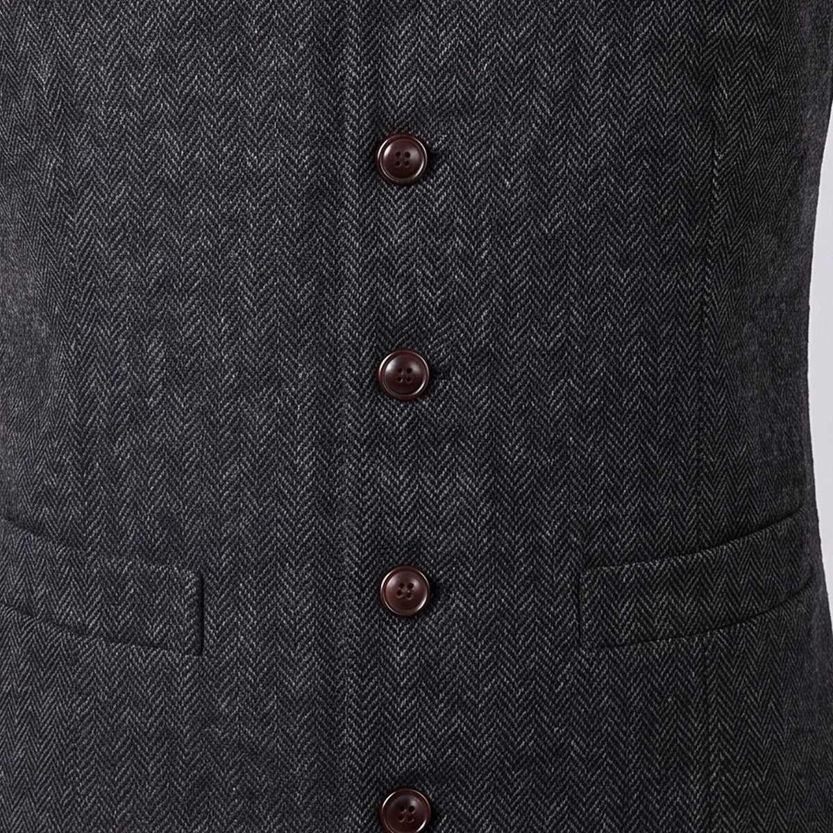 Close view of the button front on a men's herringbone waistcoat