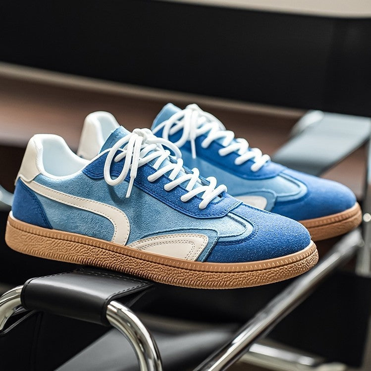 Gresham sneakers in Blue resting on a chair
