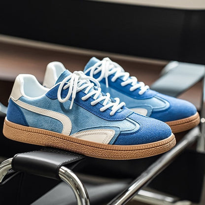Gresham sneakers in Blue resting on a chair