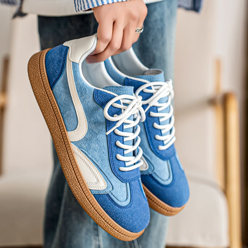 Gresham sneakers in Blue held in the hand