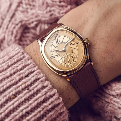 Harcourt gold-toned oval watch with a pink knit sleeve
