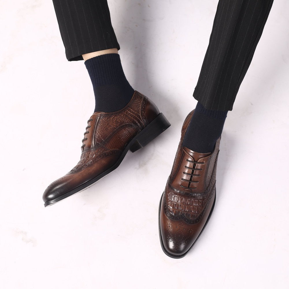 Kendrick brogue oxfords worn with dark trousers