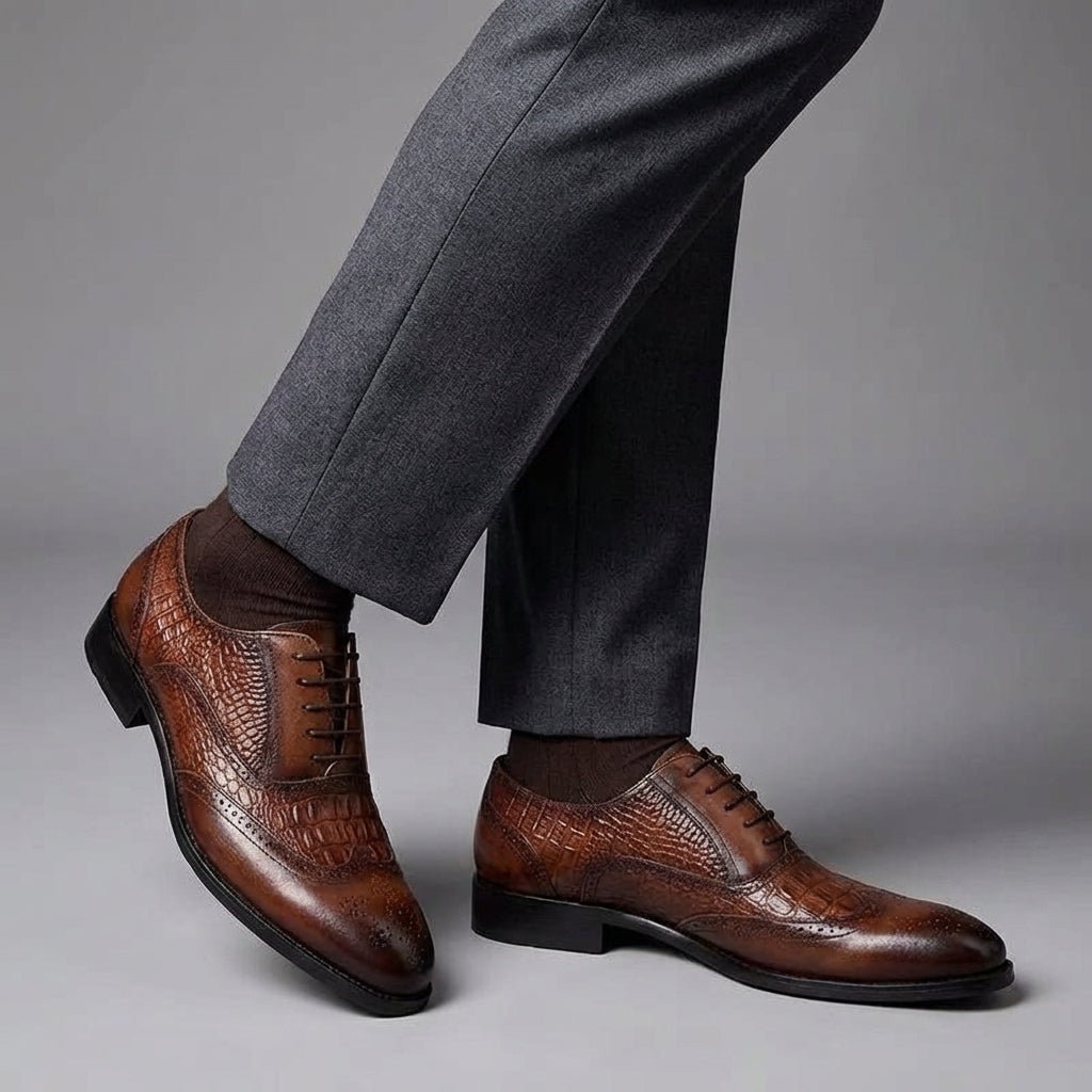 Kendrick brogue oxfords worn with grey trousers