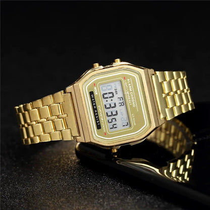 Gold Kesler digital watch at an angle on a dark surface