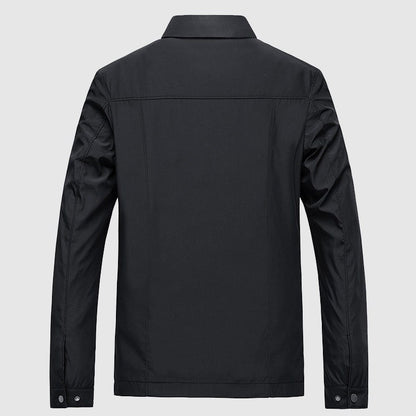 Back of the black jacket with a yoke seam and flat collar