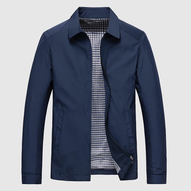 Navy jacket laid flat with the zip open to show the checked lining