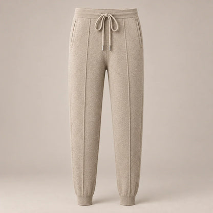 Men's beige knit drawstring joggers with ribbed cuffs, full front view
