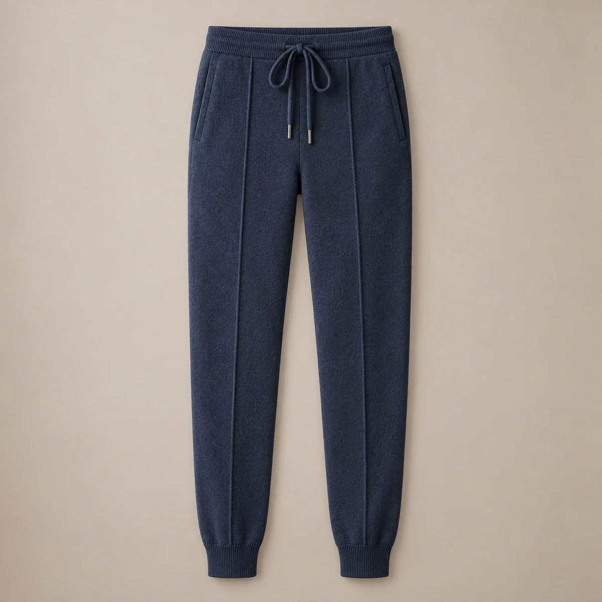 Men's dark blue knit drawstring joggers with ribbed cuffs, full front view