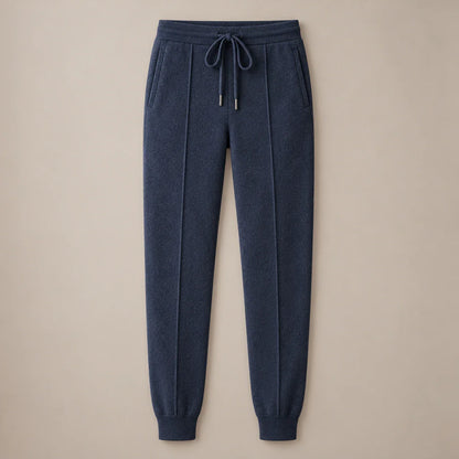 Men's dark blue knit drawstring joggers with ribbed cuffs, full front view